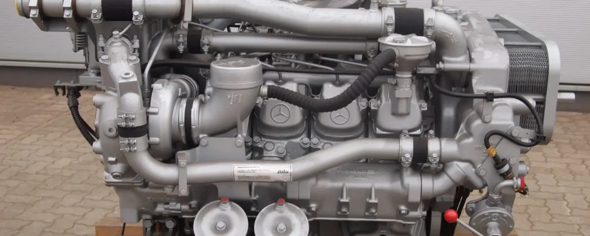 MTU / Daimler 8V183TD13 (OM442A) diesel engine on a wooden pallet in an industrial environment.